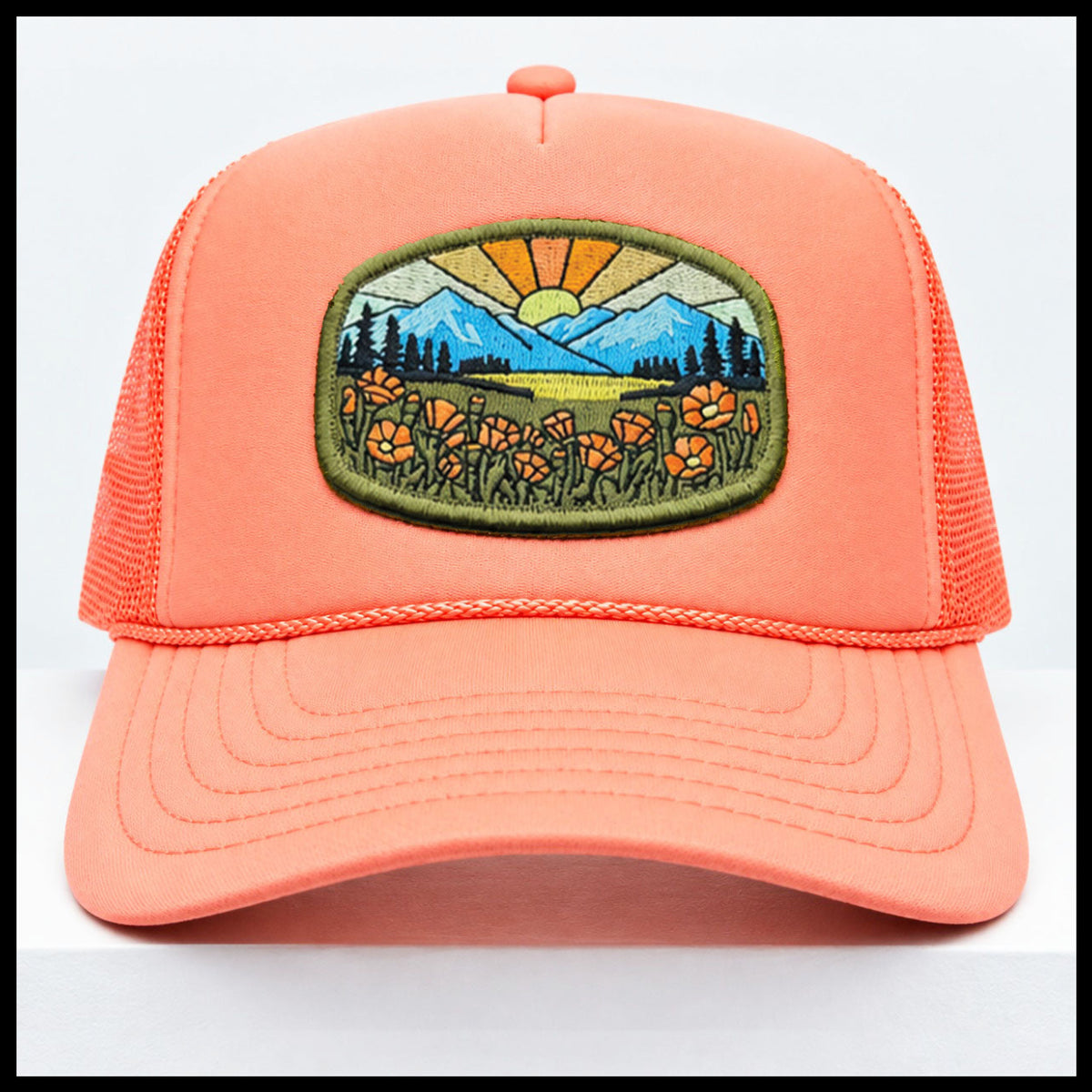 Port Sandz peach colored California Poppy Mesh-Back Trucker Hat. Vicose embroidered patch on front picturing sun and rays, mountains and California's State Flower, the golden poppy in fields. 