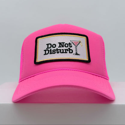 Port Sandz Do Not Disturb neon pink trucker hat with cosmopolitan glass on patch - front view