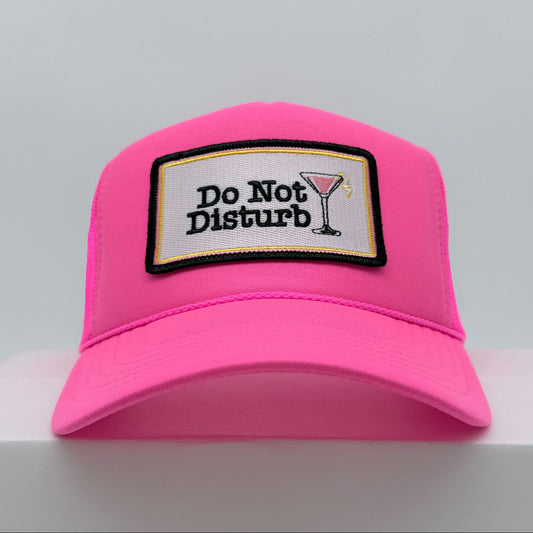 Port Sandz Do Not Disturb neon pink trucker hat with cosmopolitan glass on patch - front view