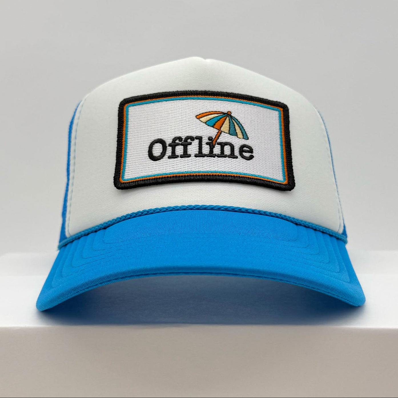 Port Sandz Offline Trucker Hat front in Bright Blue and White
